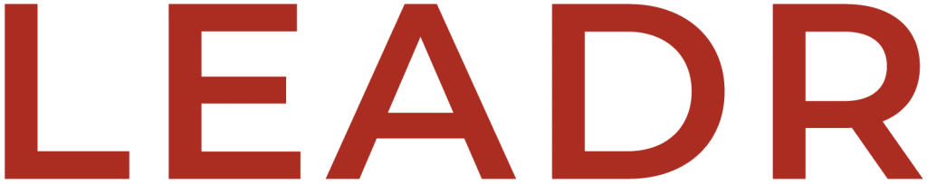 Large, bold, red capital letters spell out the word "LEADR" on a light gray background.