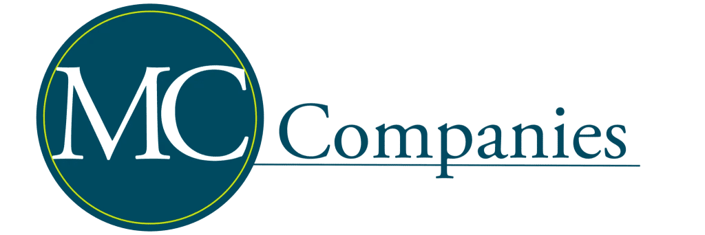 Logo displaying the text "MC Companies" with "MC" in large white letters inside a blue circle and "Companies" in blue text to the right.
