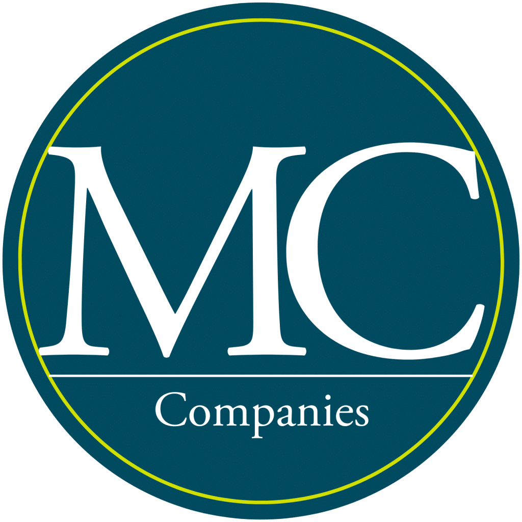 A teal circle with a thin yellow border contains the large white letters "MC" above the word "Companies" in smaller white text.