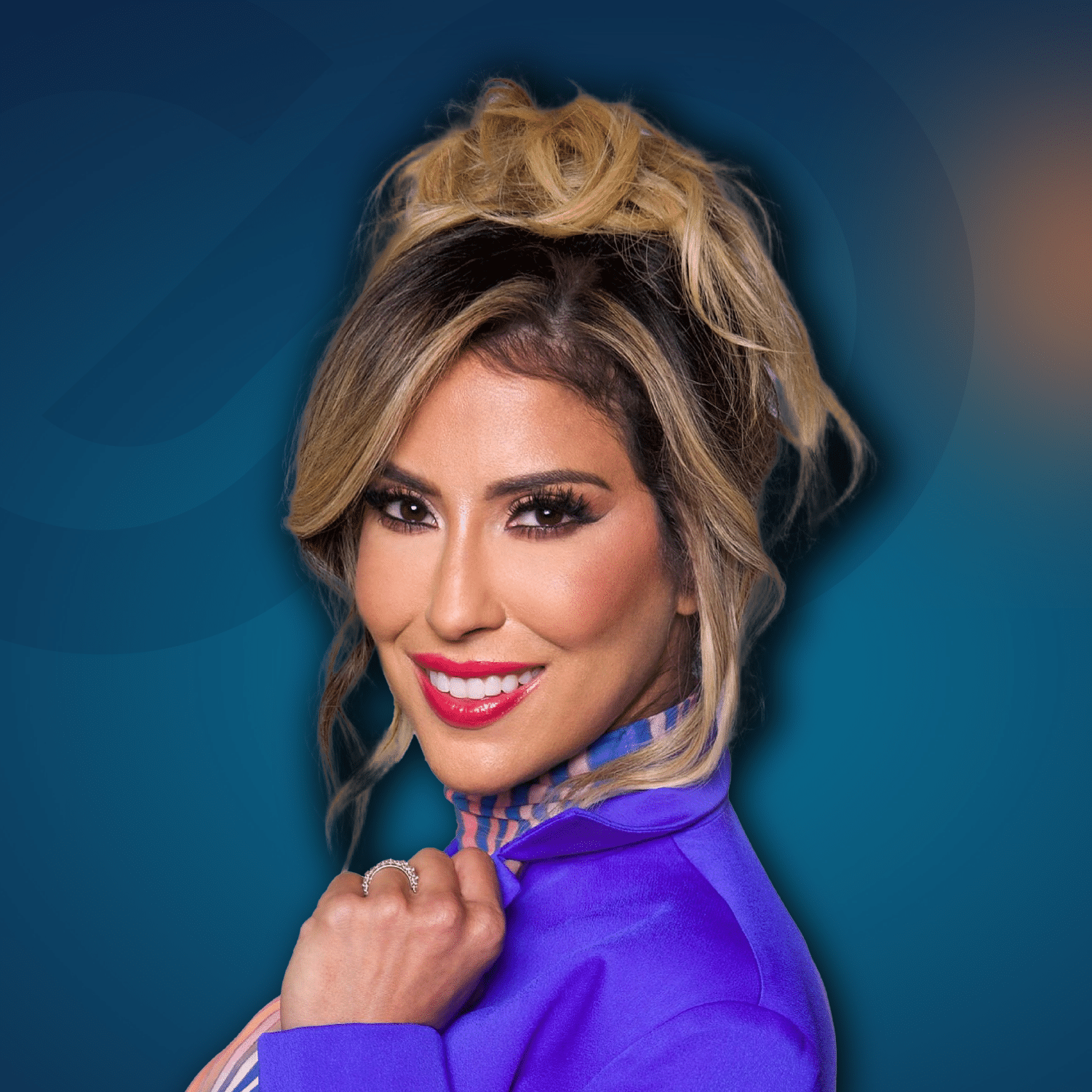 Woman with long wavy blonde hair in an updo, wearing a purple blazer, smiling at the camera against a blue gradient background.